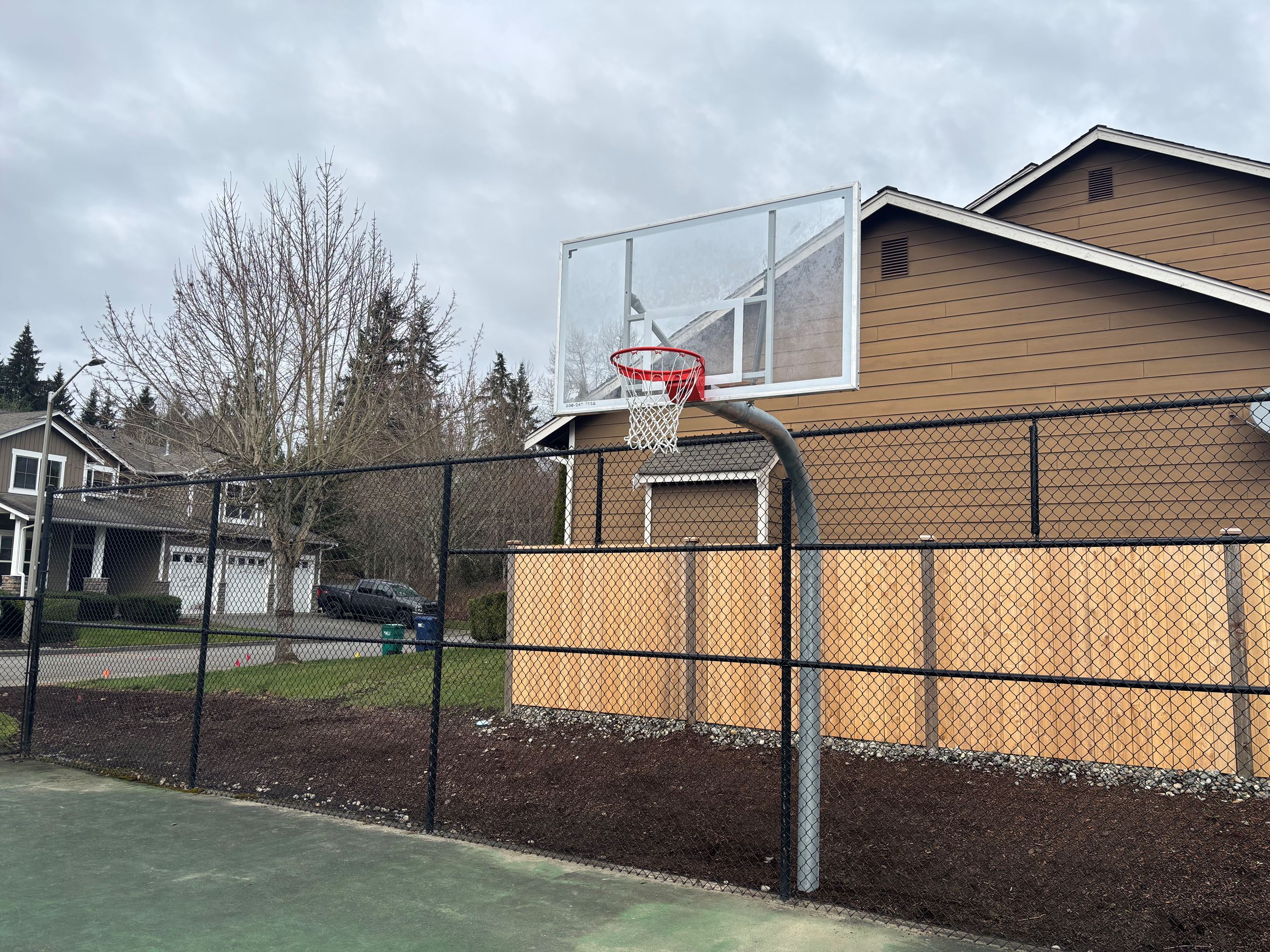 Photo of new glass basketball hoop.